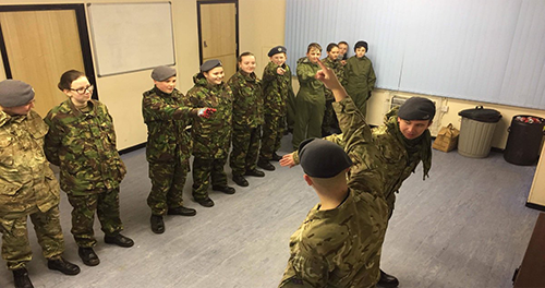 soldiers communicating hand signals